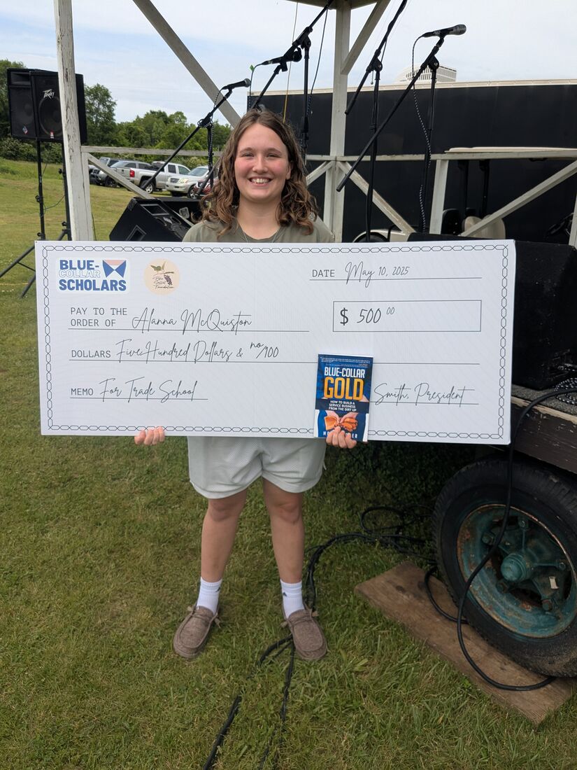 Alana McQuiston holding her 2025 Blue-Collar Scholars check